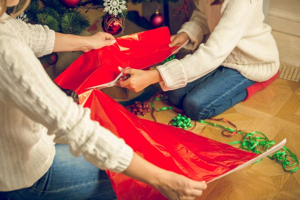 people wrapping Christmas gifts